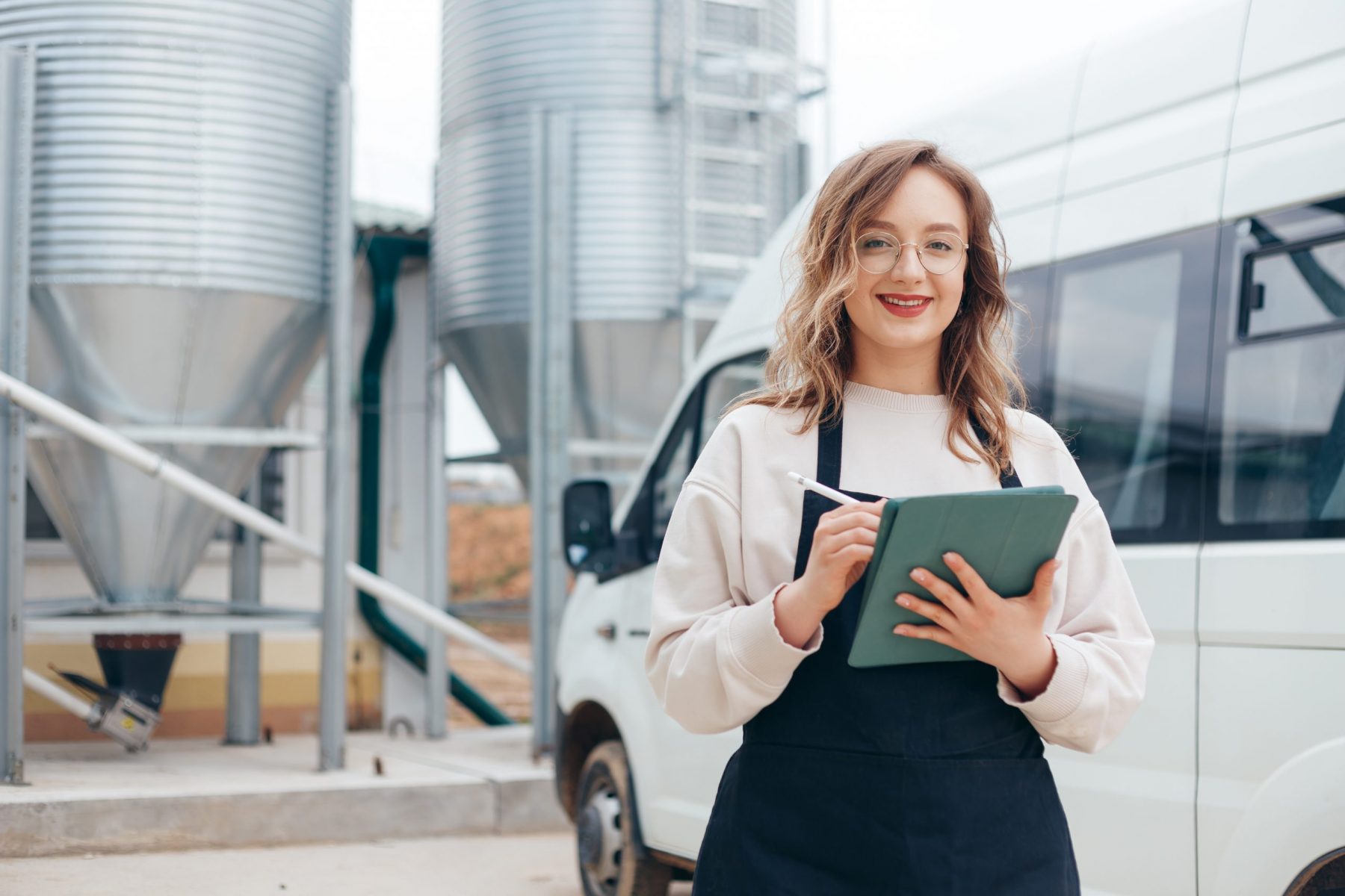 Woman Agricultural Engineer with Tablet Near Cyclone Industrial Equipment